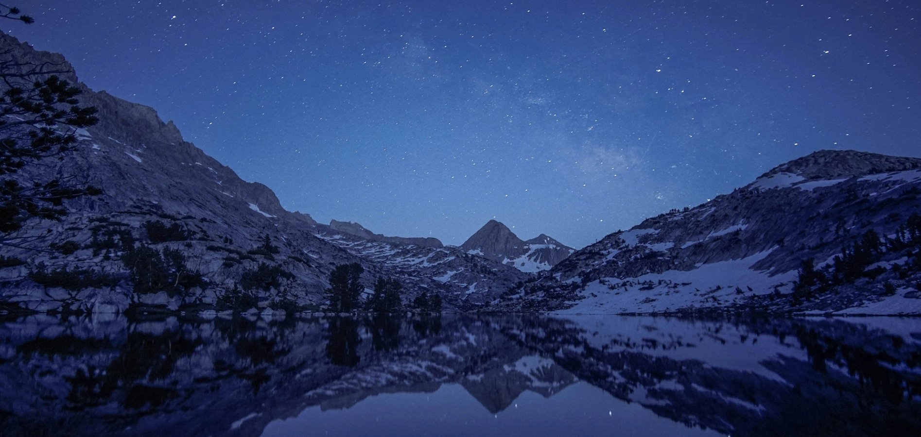 Granite peaks and alpine lake along the John Muir Trail in California