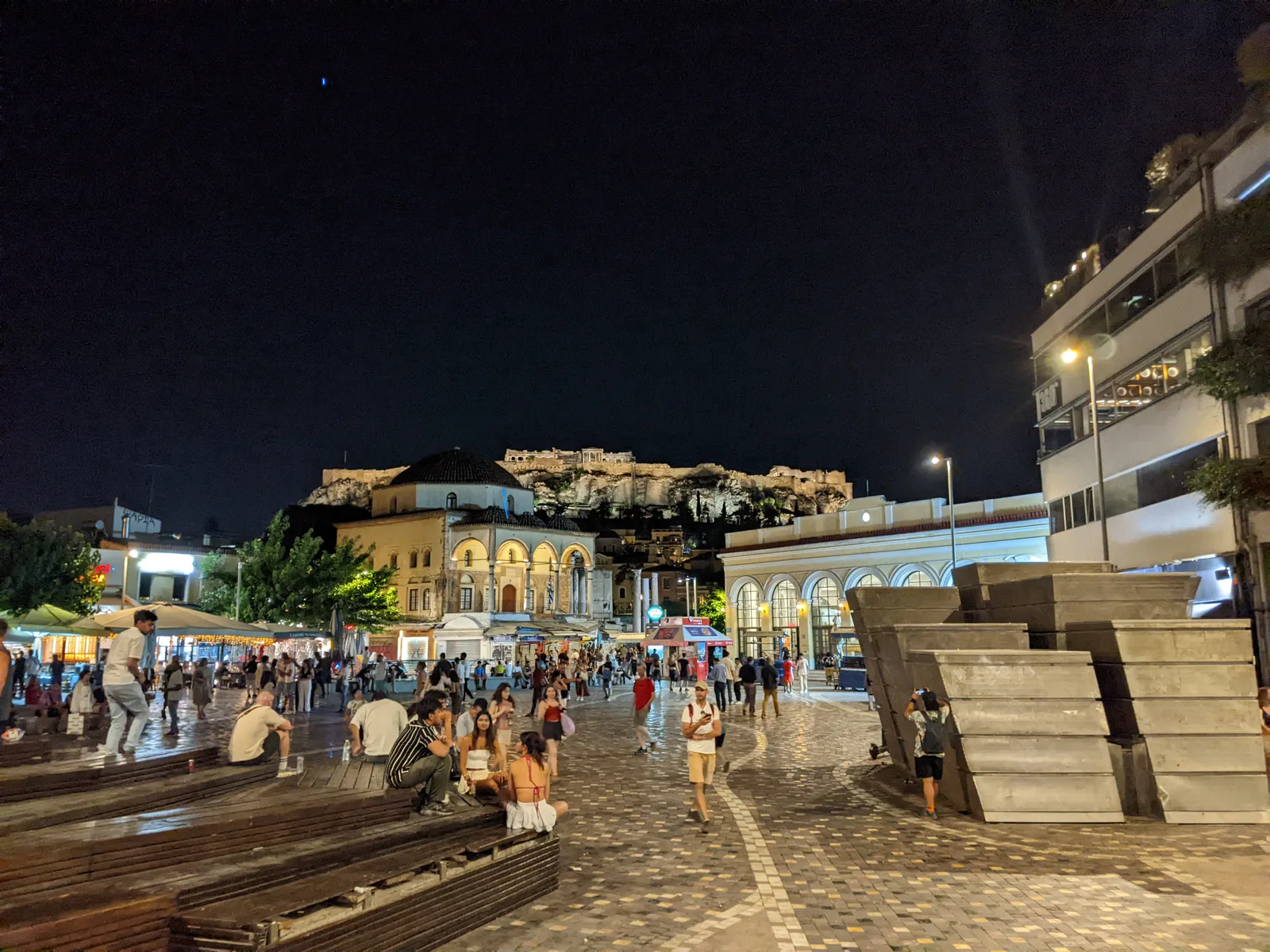 Monastiraki Square at night with the Acropolis illuminated on the hill behind, Athens