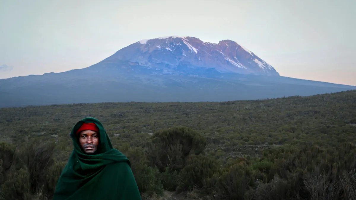 Trekkers approaching the snowy summit crater of Mount Kilimanjaro in Tanzania