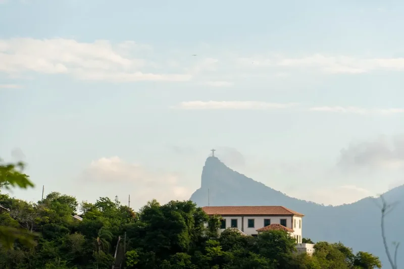 Building on a hill with mountain behind