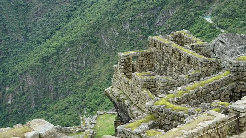 a stone wall with a stone walkway