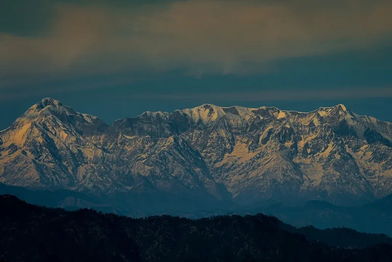 A view of a mountain range from a distance