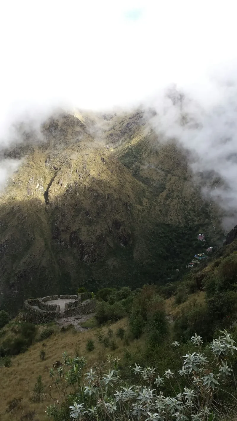 a view of a mountain with a bridge in the foreground