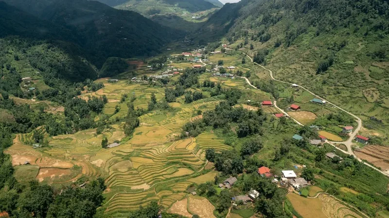 an aerial view of a village in the mountains