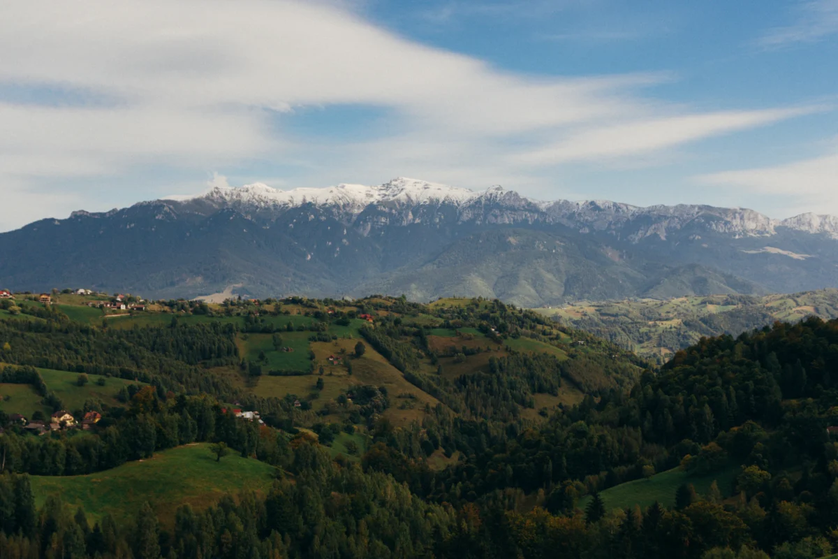 green mountains under white clouds during daytime