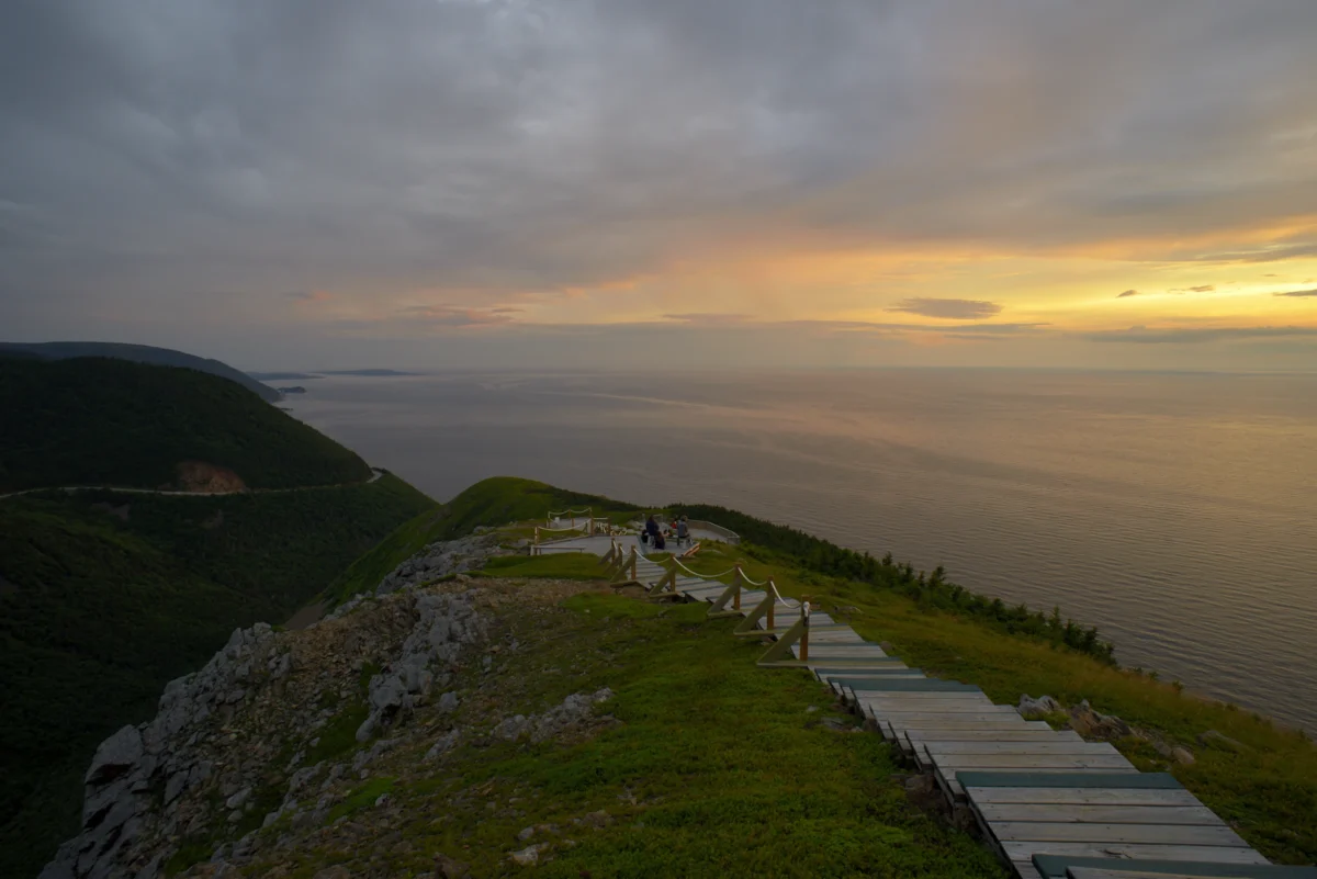 Coastal path overlooking the ocean at sunset