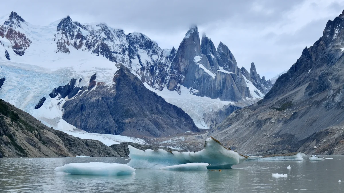 A mountain range with a body of water in front of it