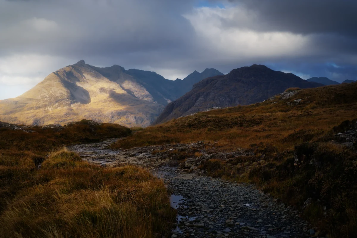 snowy mountain under gray sky