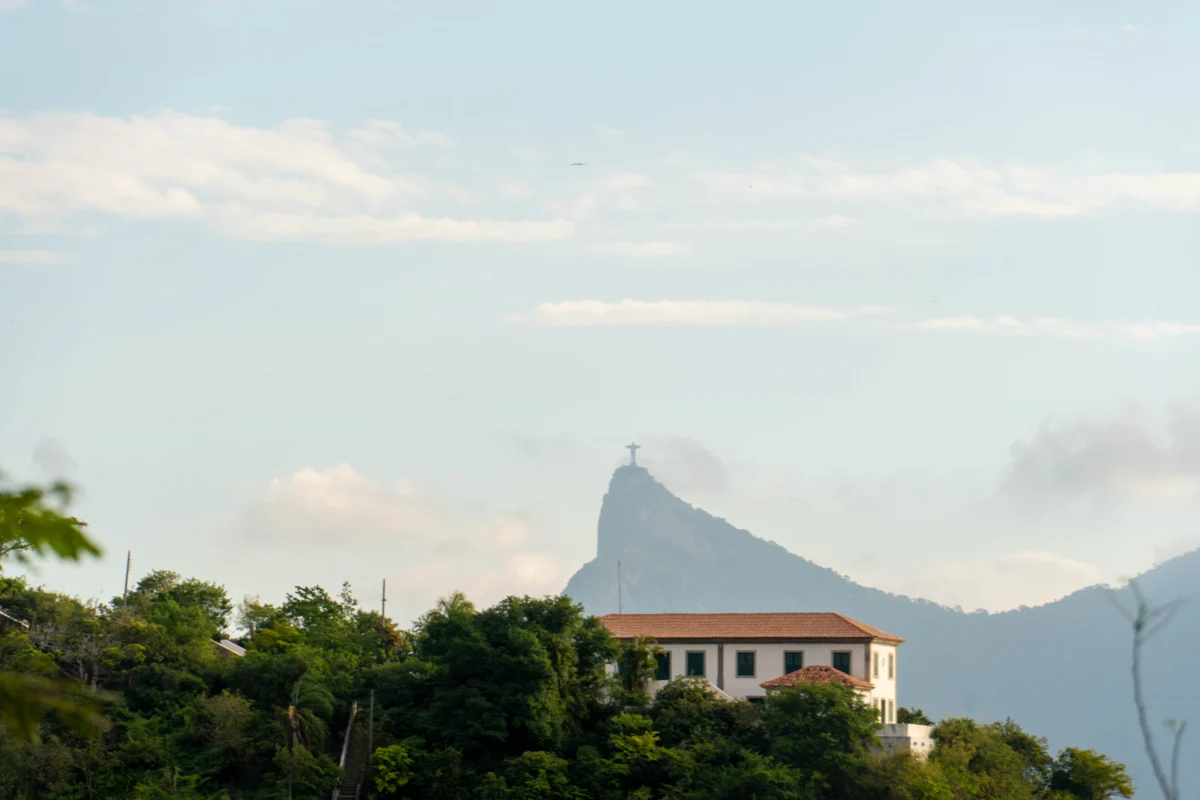 Building on a hill with mountain behind