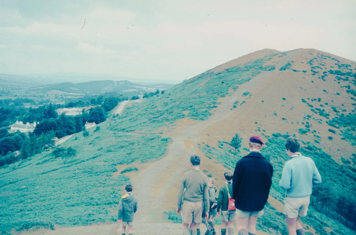 Group of boys hiking up a mountain.