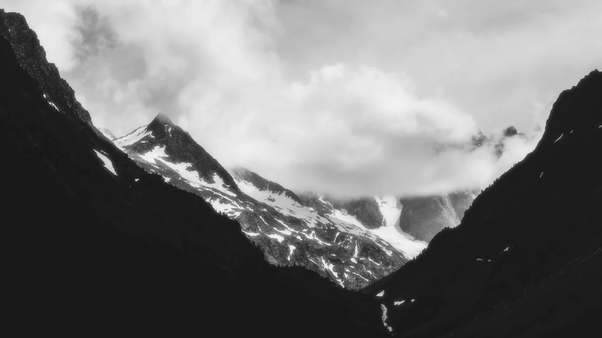 a black and white photo of a mountain range