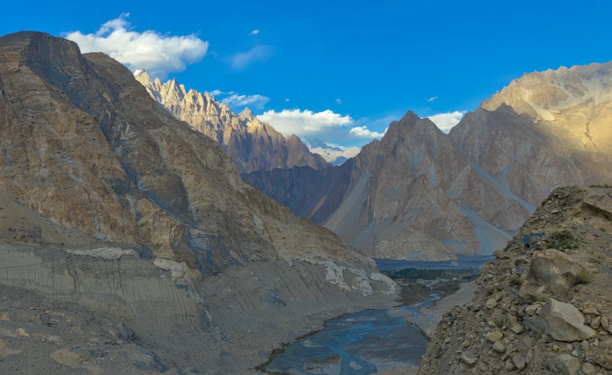 Majestic mountain peaks under a vibrant blue sky.
