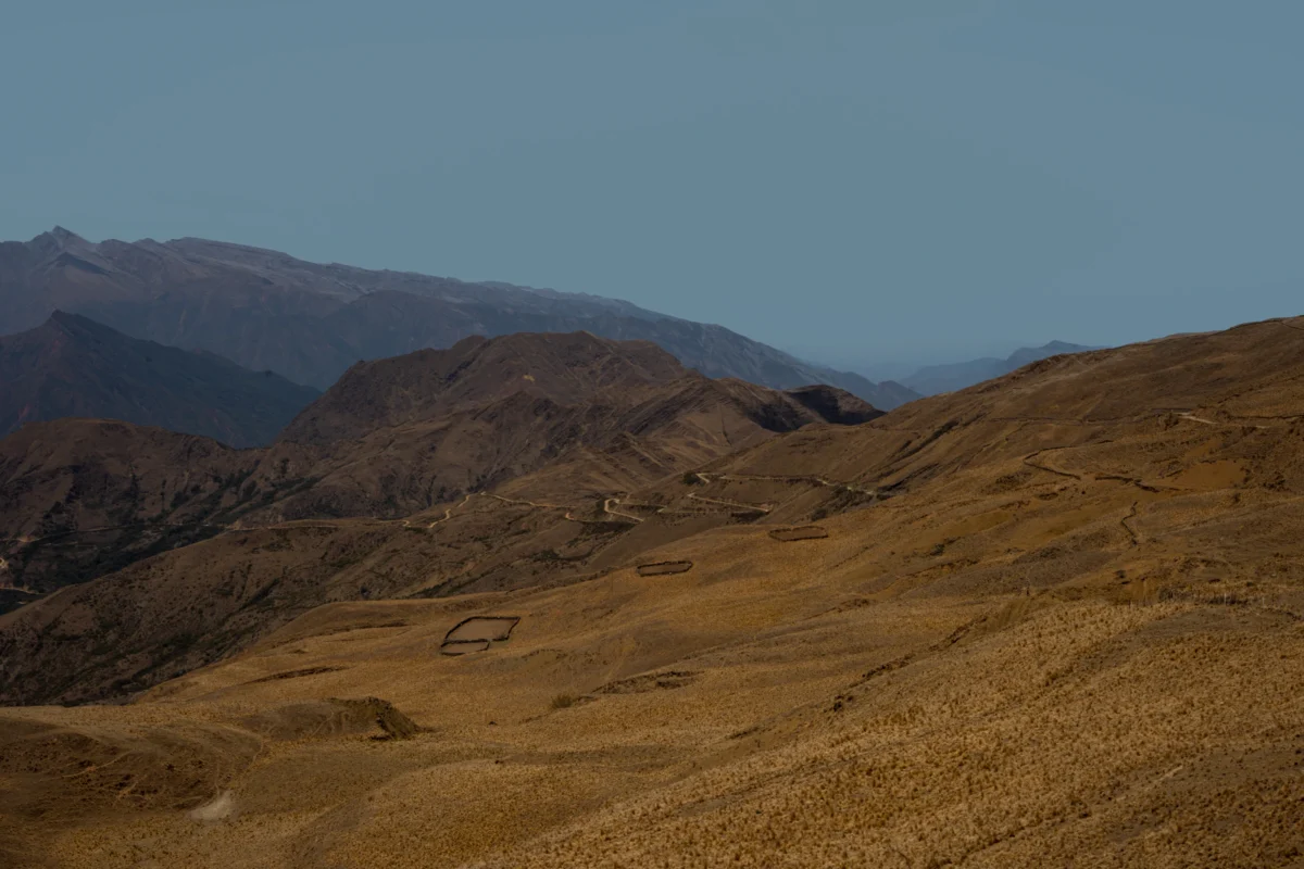 Dry, rolling hills under a clear blue sky
