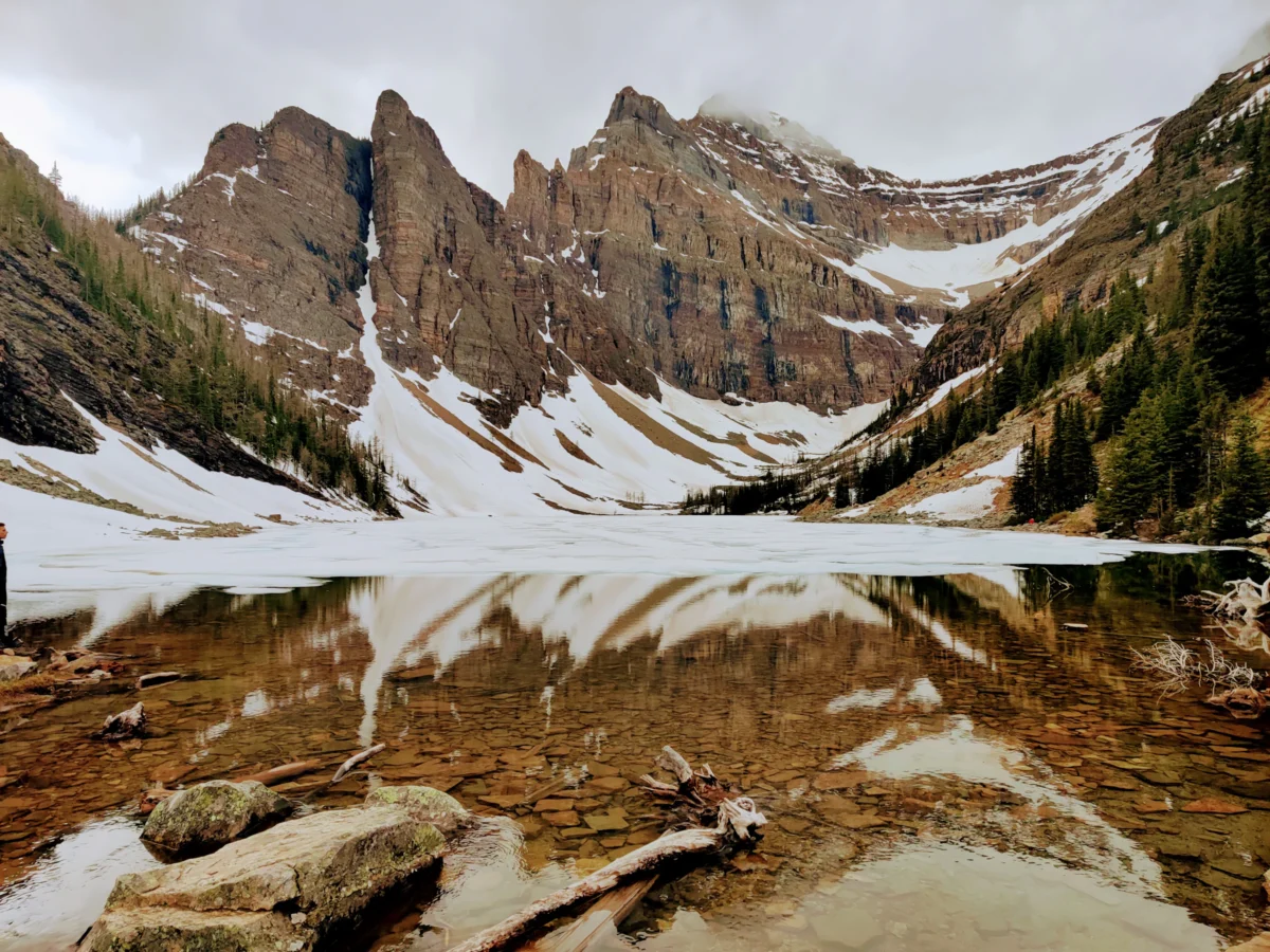 a river running through a snowy mountainous region