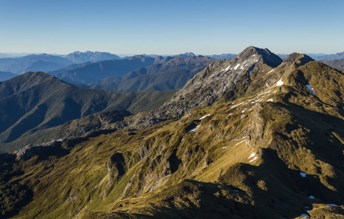 A view of the top of a mountain at sunset