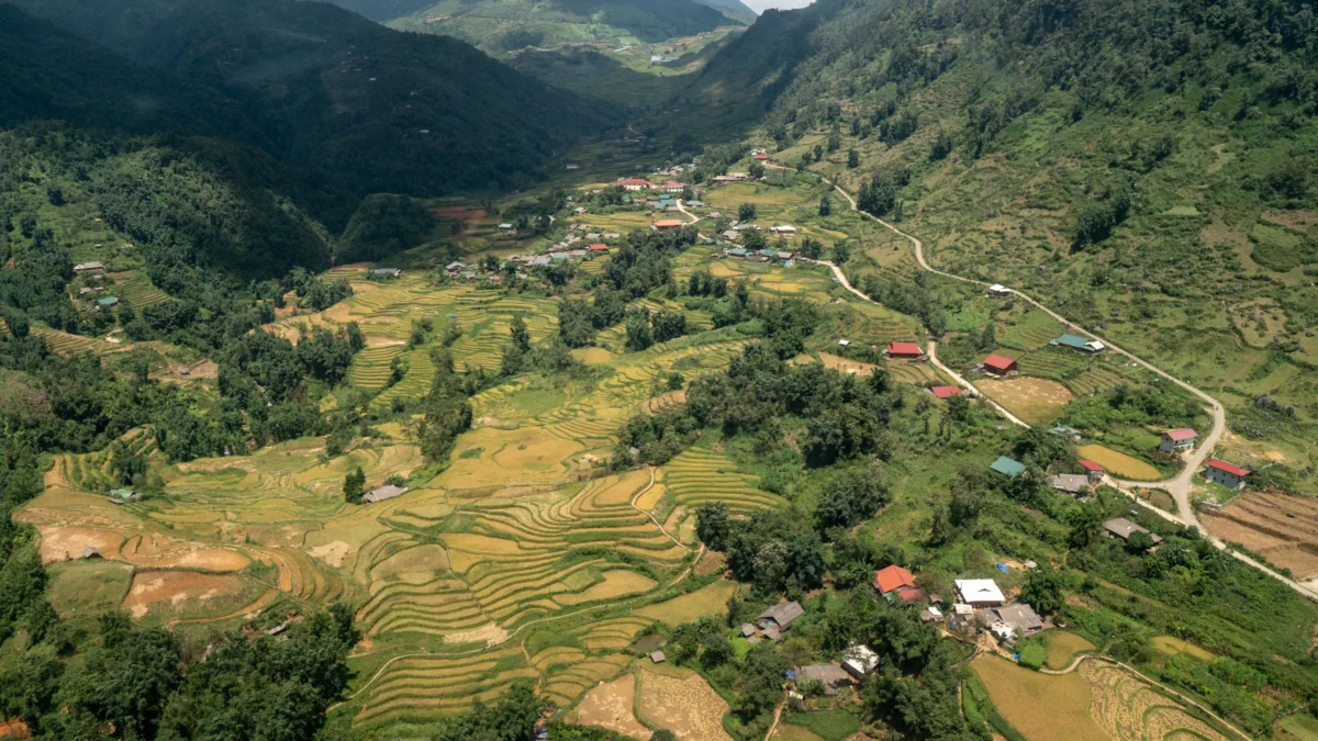 an aerial view of a village in the mountains