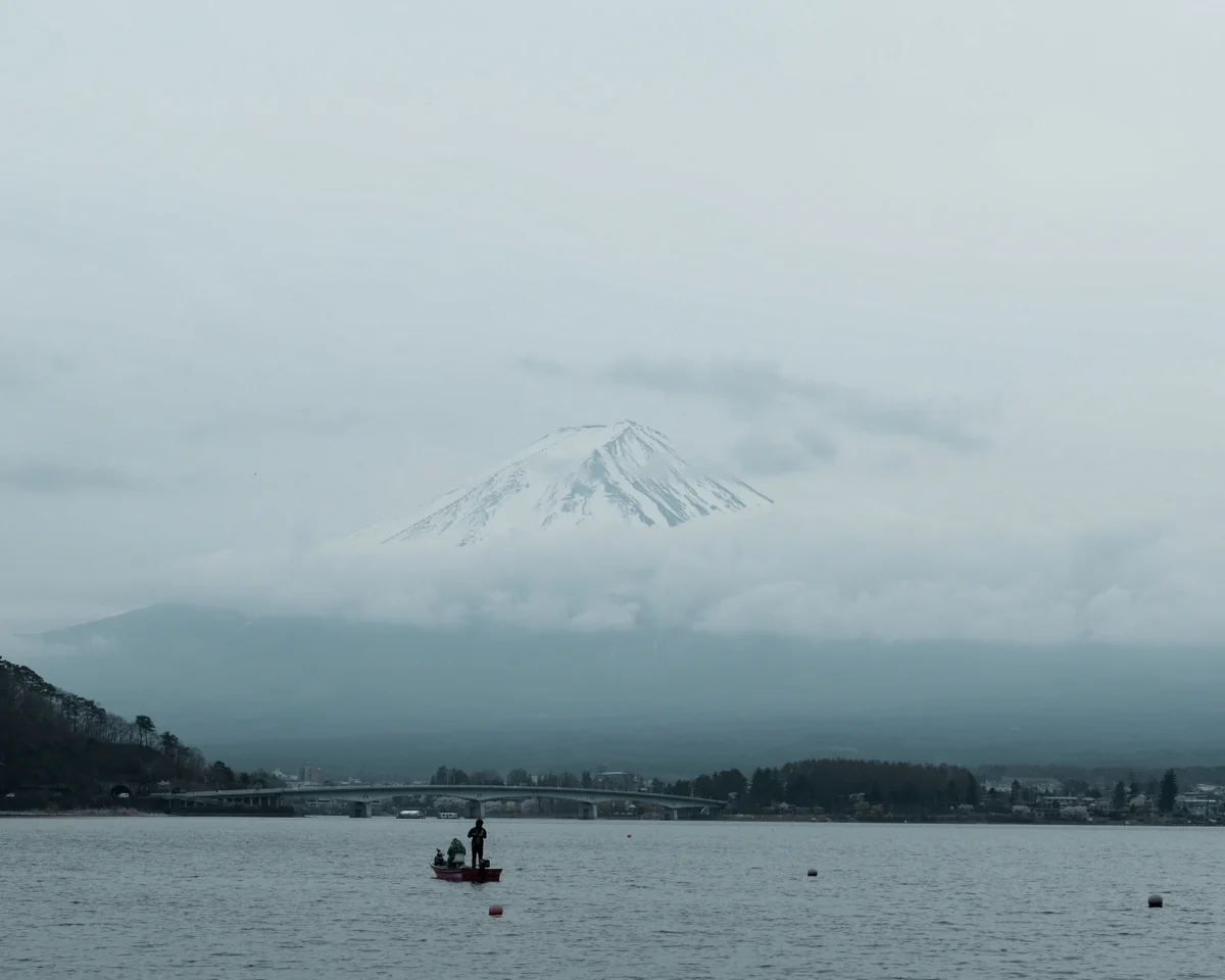 people riding on boat on lake during daytime