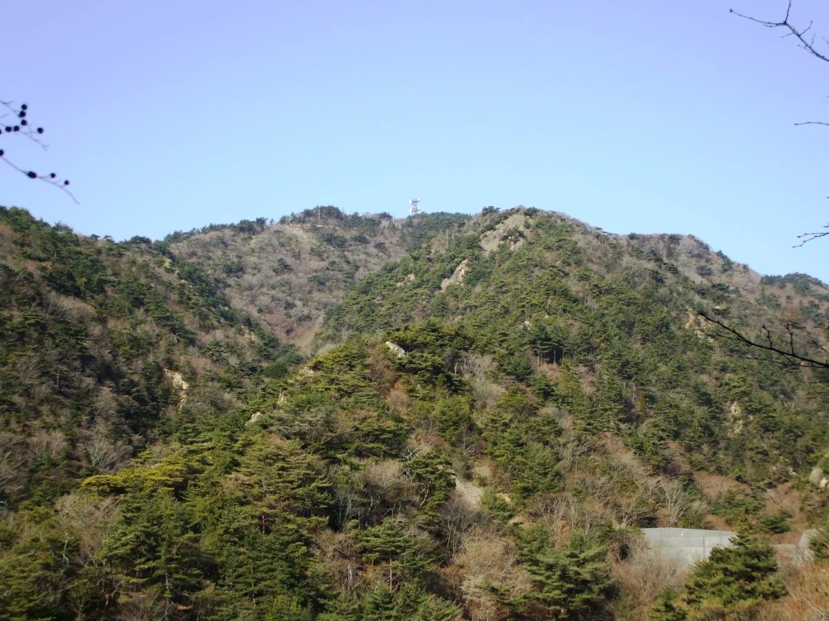 a mountain with a snow capped peak in the distance