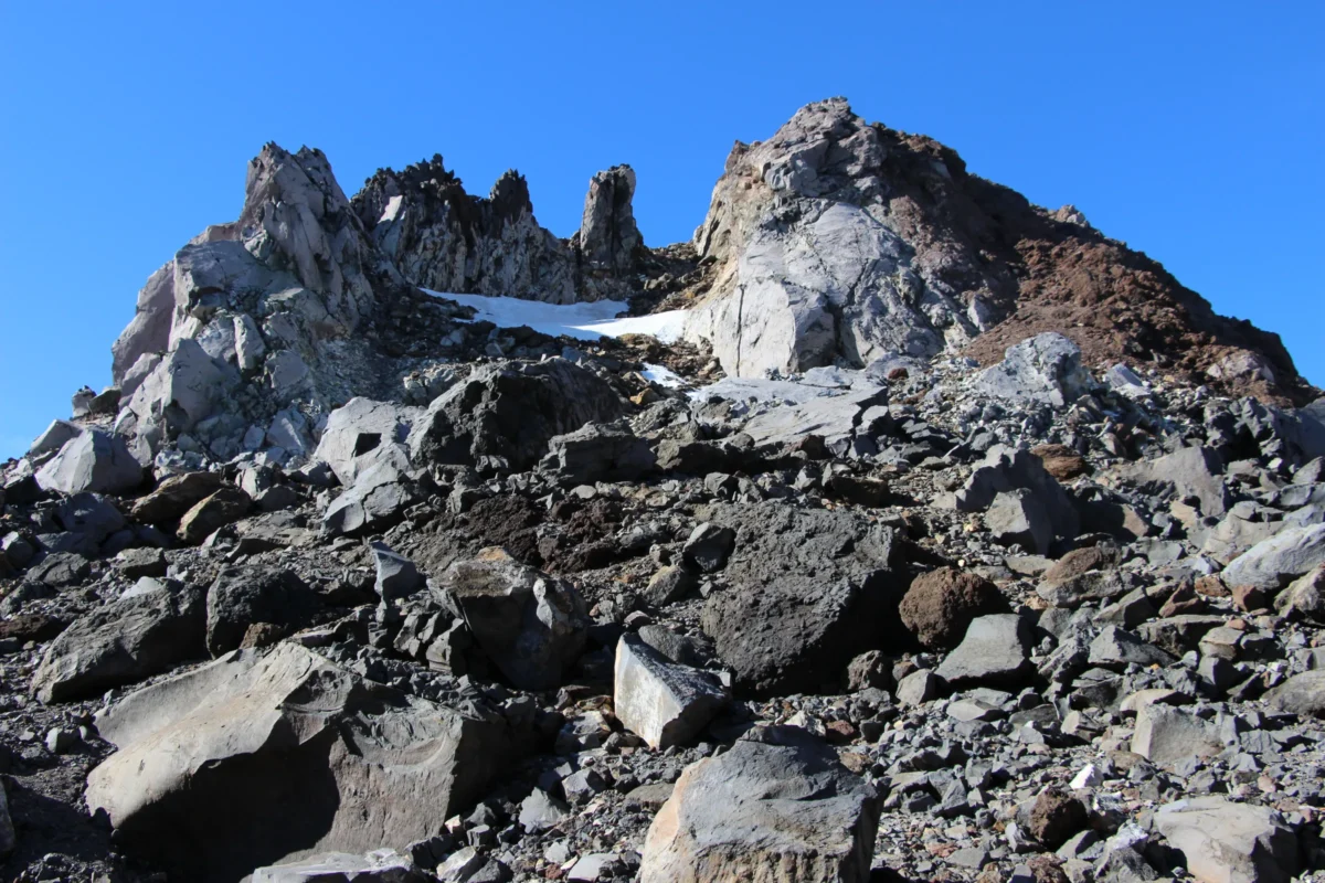 Snow-capped mountain range under a blue sky