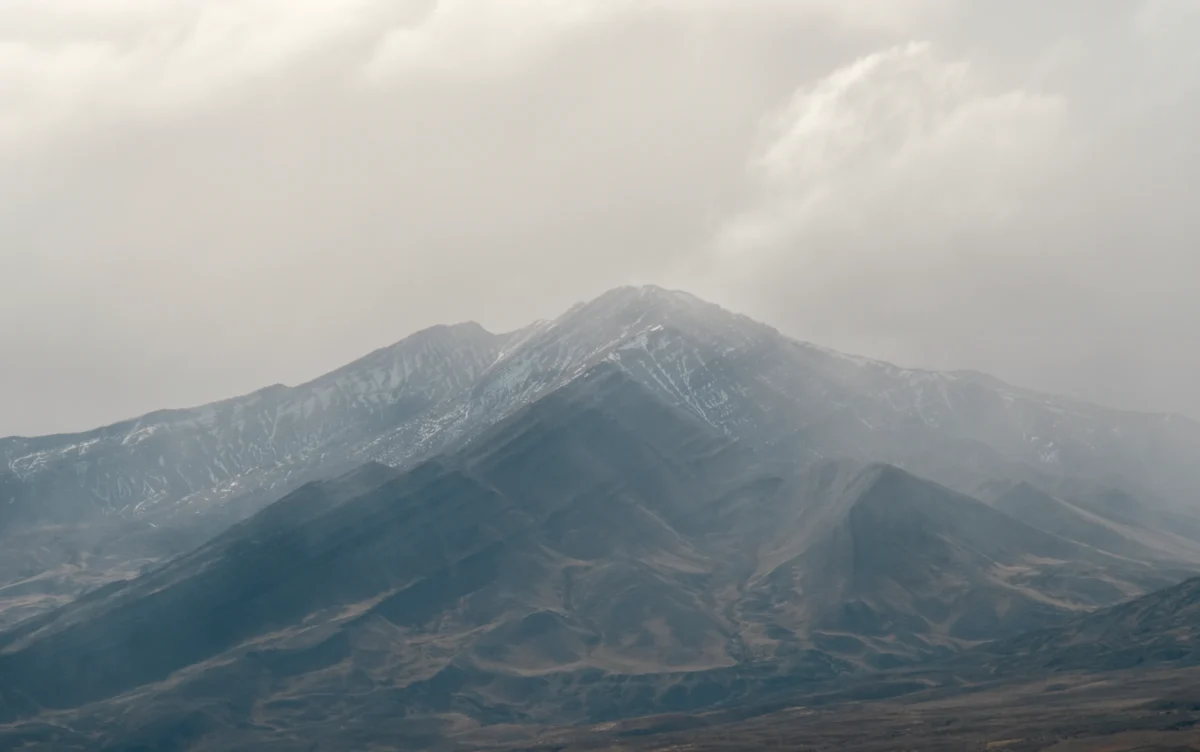 a mountain with a valley below