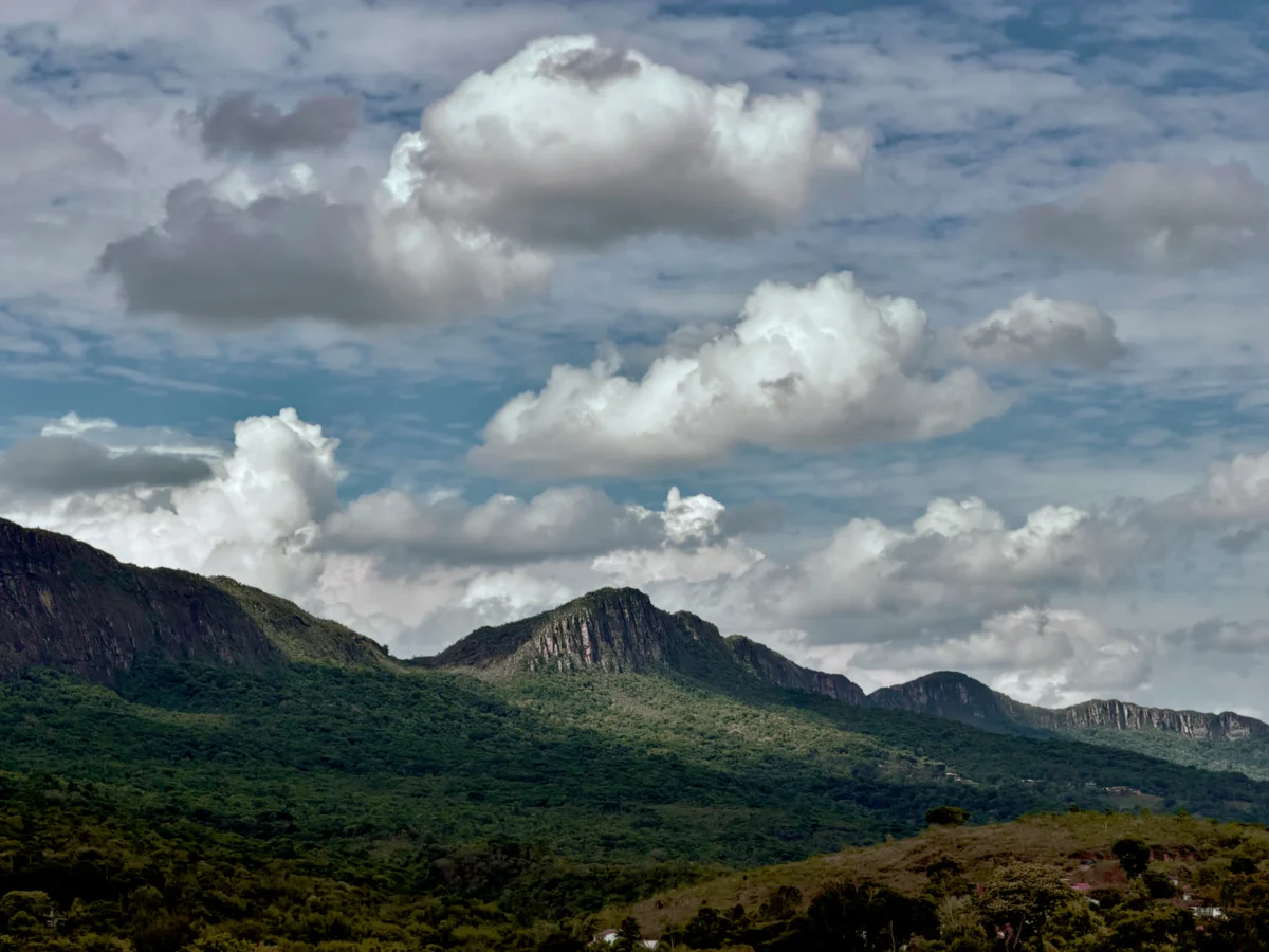 Rolling green hills under a cloudy sky