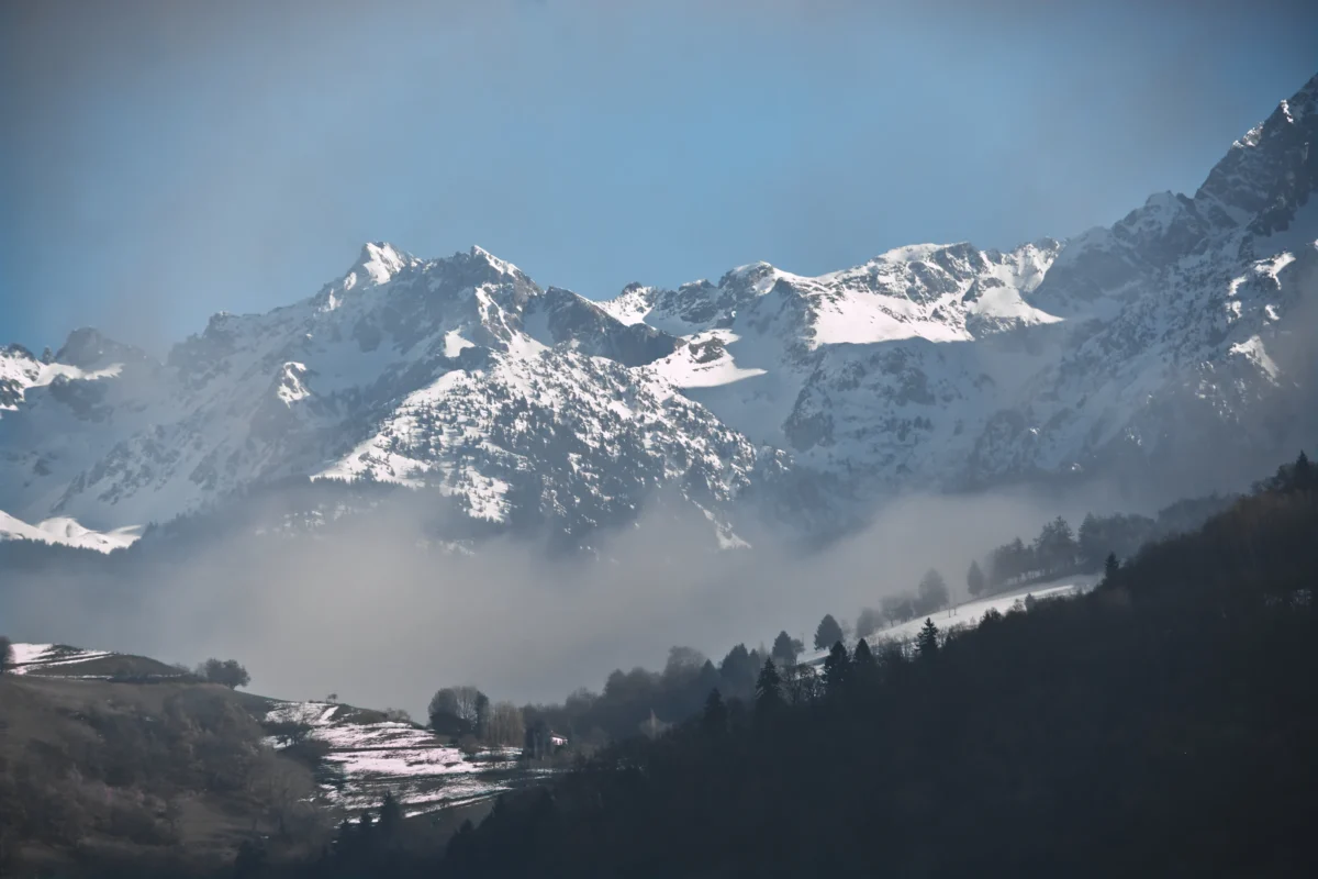 a view of a mountain range covered in snow