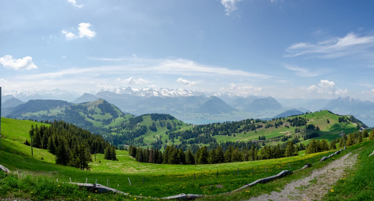 a mountain with clouds below