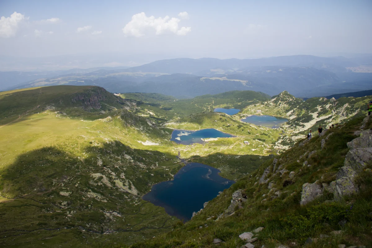 a view of a mountain range with a lake in the middle