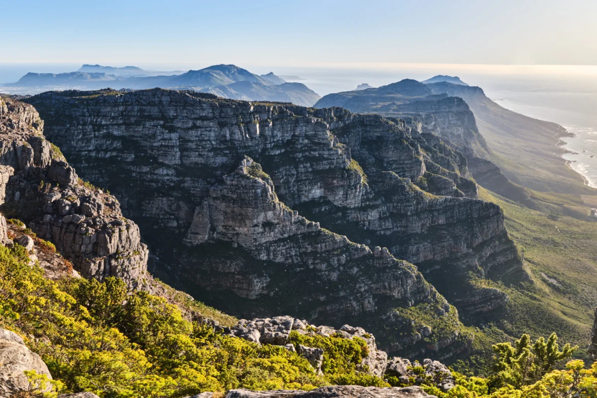 a view of a mountain range with a body of water in the distance
