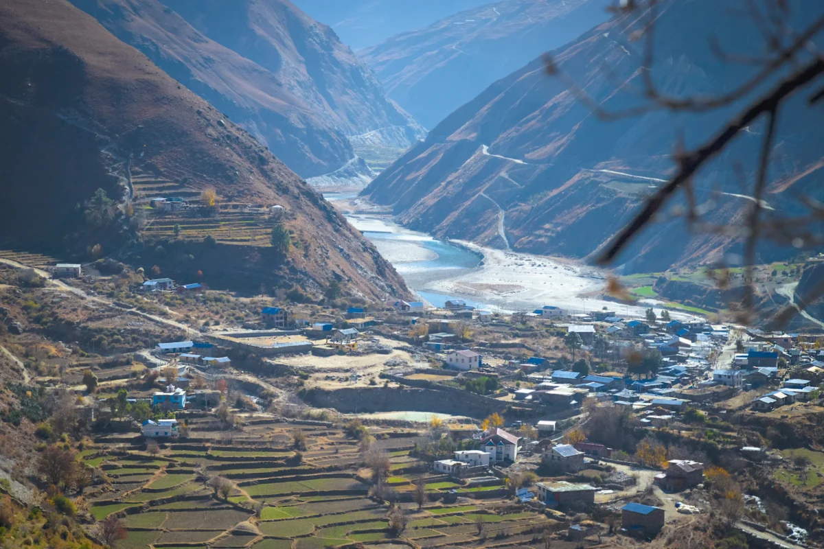 a village in a valley surrounded by mountains