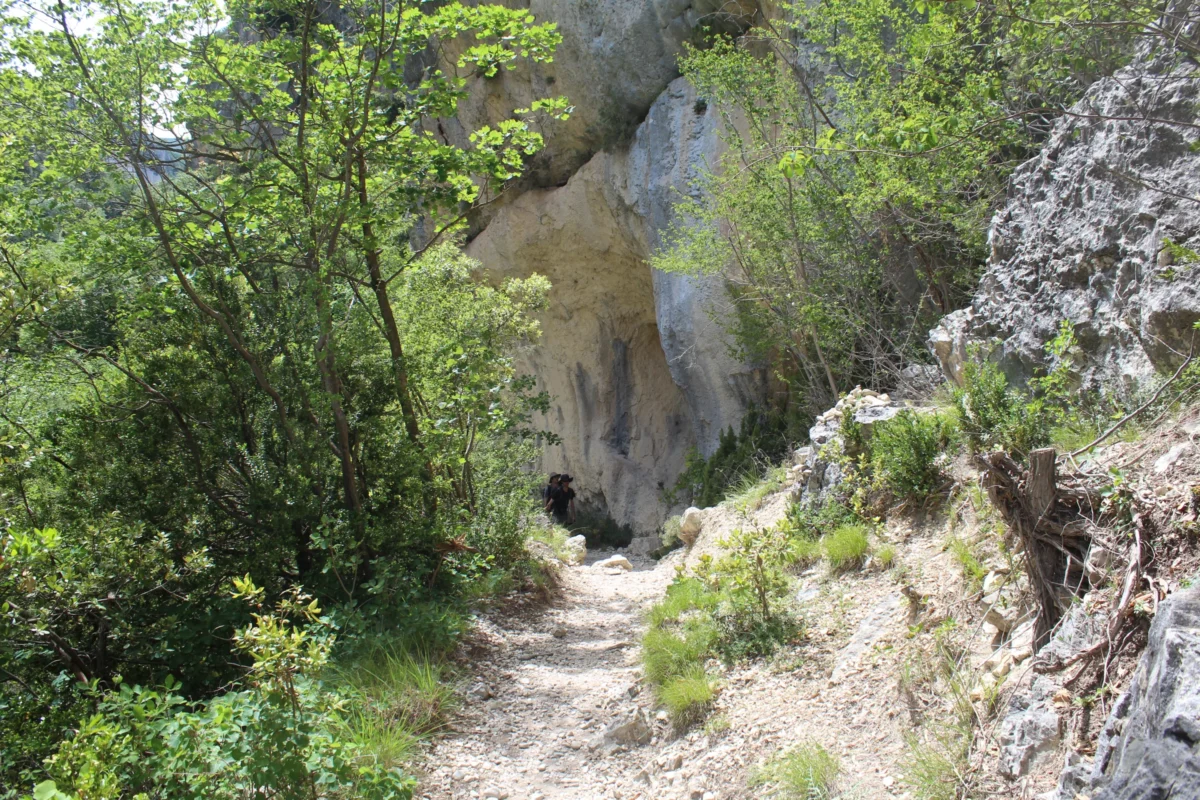 a man climbing up the side of a mountain