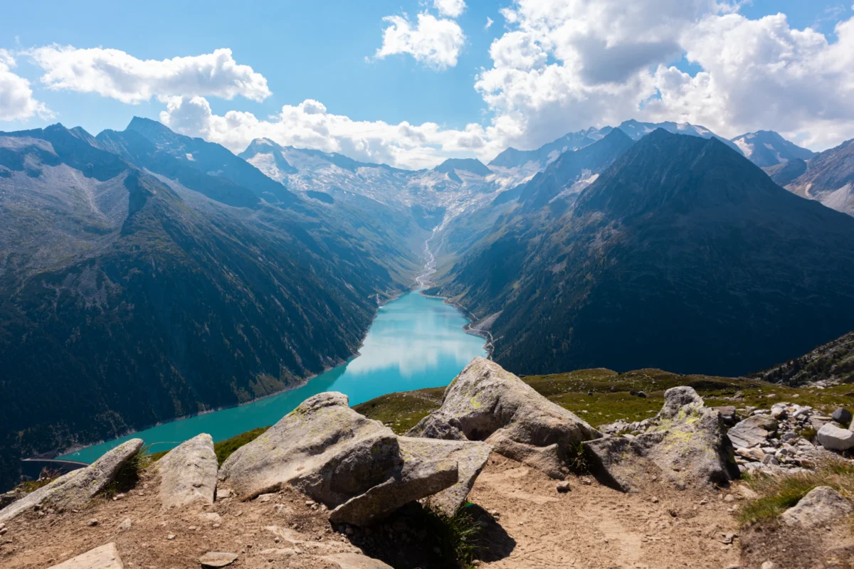 A scenic view of mountains and a road