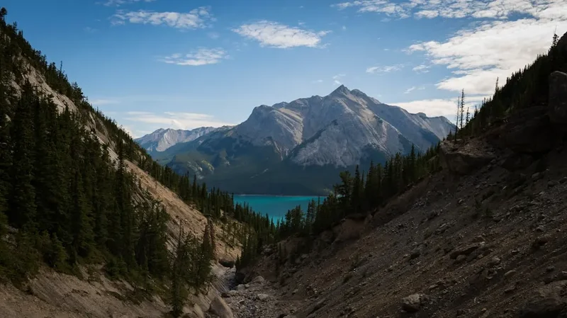 A scenic view of a mountain lake and mountains