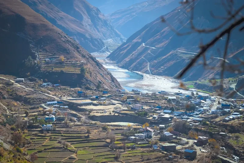 a village in a valley surrounded by mountains