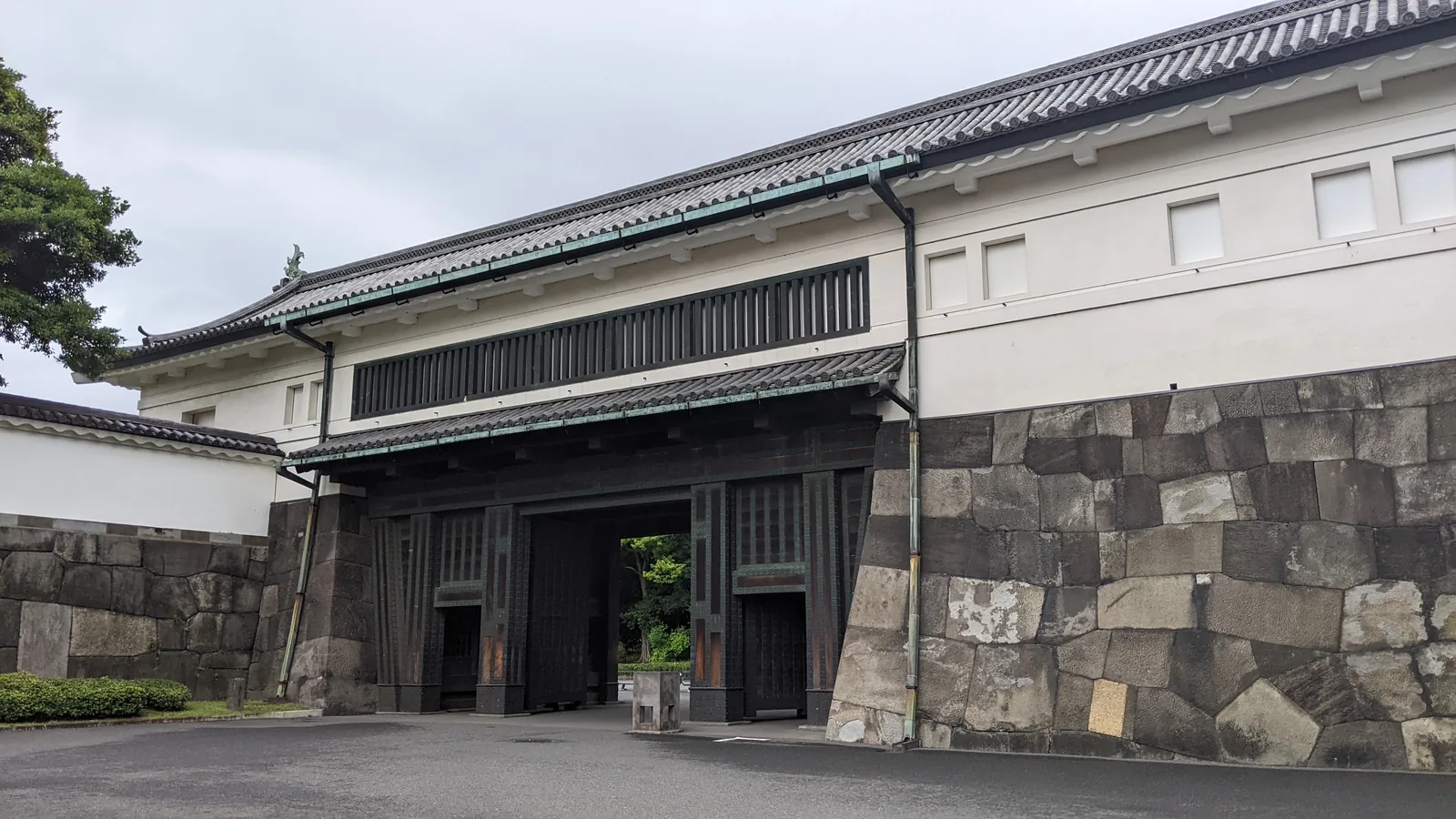 Historic stone and white-walled castle gate at the Tokyo Imperial Palace