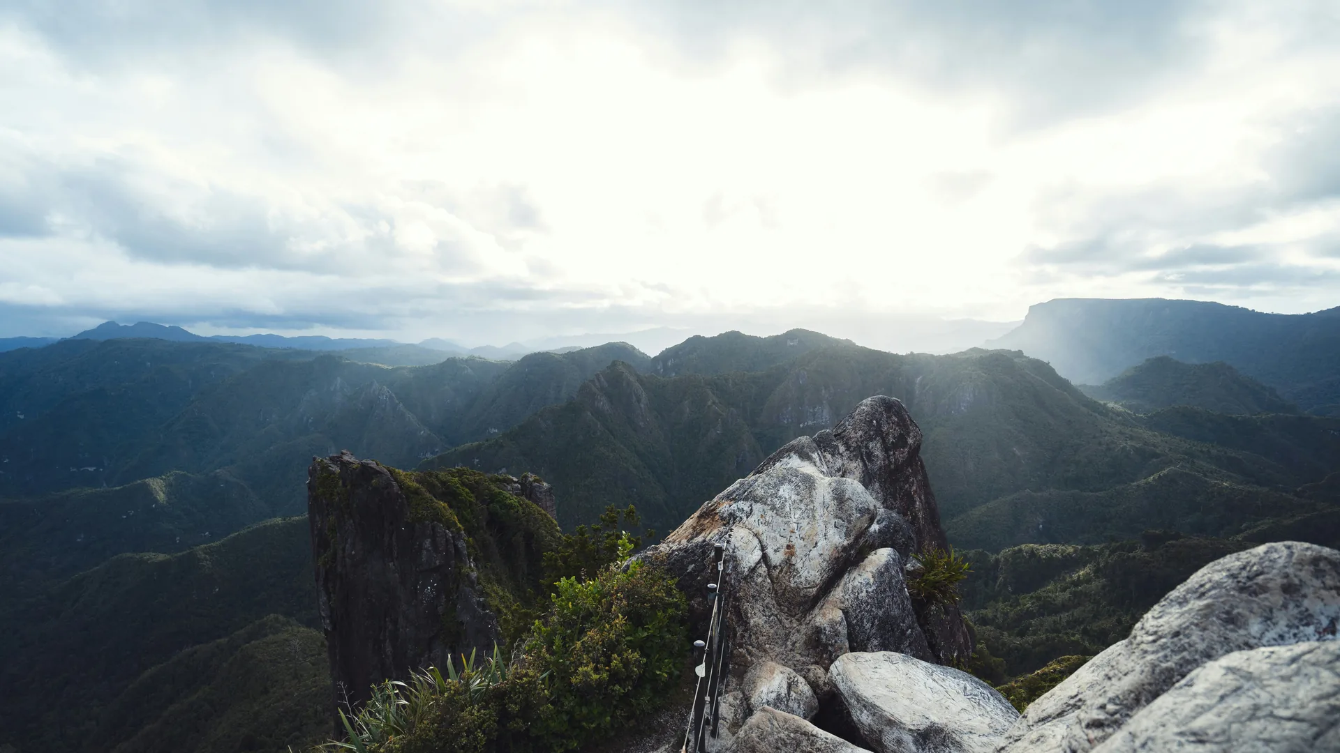Hiker on a mountain ridge with a backpack